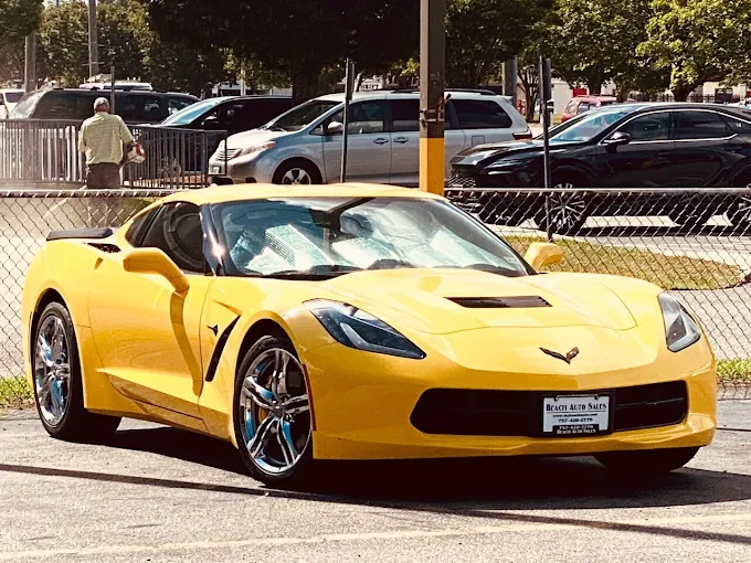 Yellow Corvette Stingray on the Beach Auto Sales lot